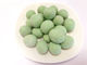 O Wasabi da forma redonda revestiu a cor verde do petisco do amendoim custada amendoins friáveis
