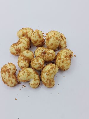 Amêndoas de caju inteiras de qualidade premium Coco Revestido de caju Snack com explosão de sabor de camada dupla e qualidade de exportação