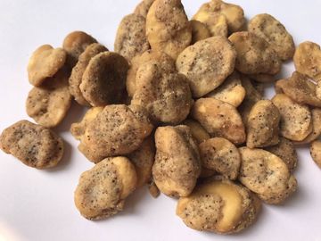 Petisco revestido delicioso das favas, sabor secado saudável de Cajun das favas